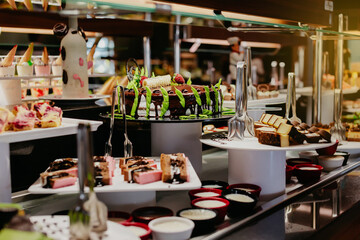 Candy buffet in a restaurant with cake.