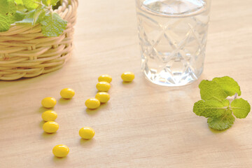 Yellow pills on a desk
