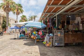 Fototapeta na wymiar Small shop in the Arab market selling various souvenirs in the old city of Acre in northern Israel