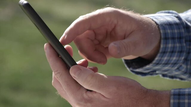 One Person Sending and Reading Messages from His Cellphone. Man Text Using Mobile Phone Connectivity.