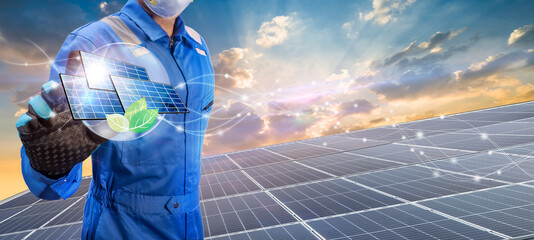 Technician holding Solar cell and eco icon over solar cell system, Solar cell energy, Care of the...