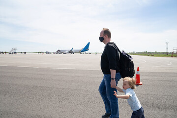 Dad and child rush to the plane
