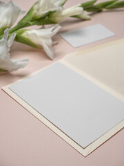 Blank party invitation card and table place card with gladiolus flower.