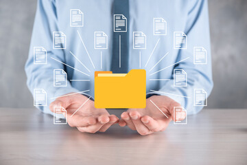 Document Management System DMS .Businessman hold folder and document icon.Software for archiving,...