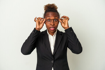 Young business african american woman isolated on white background keeping eyes opened to find a success opportunity.