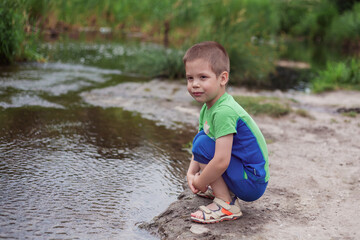 Boy with a boat. Photo taken with selective focus.