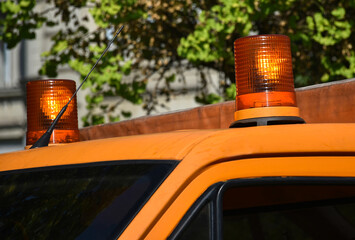 Orange colored light on the top of a vehicle