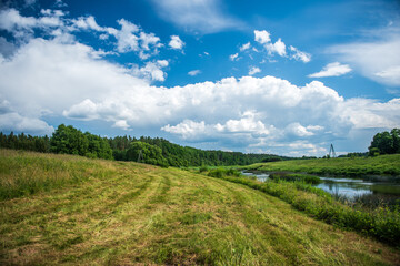 River Venta, meadow and clouds.
