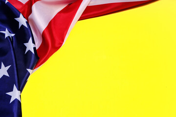 Flag of the United States of America on a yellow background.