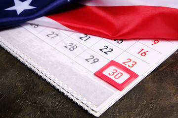 Flag United States America with calendar marked on thirtieth day Memorial Day.