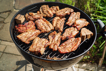 grilled pork on the flaming grill