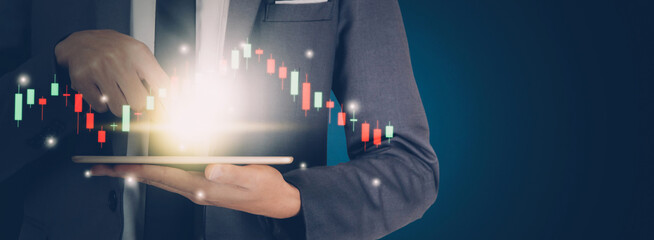 Businessman hold tablet and graph stock and funds to financial while risk with marketing,...
