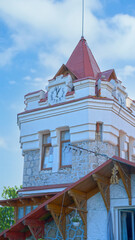 A clock tower on a blue sky background. Yalta