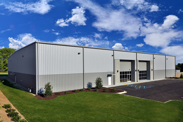 View of generic gray industrial storage warehouse building façade