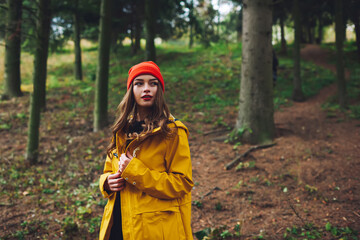 Calm lady enjoying nature in forest