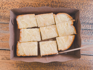 Bread toast with butter and sweet condensed milk.