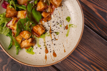 teriyaki chicken salad, green salad, bell pepper, on a white flat plate