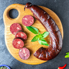 black pudding bloody sausage Cooking, fatty food on the table, healthy food meal snack copy space...