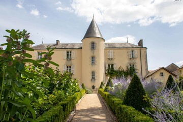 Fototapeta na wymiar 19th century Poitou Manor house at LA Belle Flower Garden in Magne France