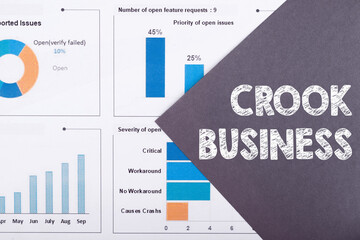 The word CROOK BUSINESS is written on a gray background with diagrams and graphs.