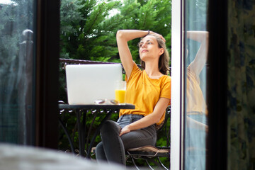 woman with laptop have a rest in summer day