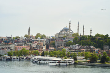 Obraz premium Istanbul, Turkey - May 2, 2021: View across the Bosphorus to the Suleymaniye Mosque.