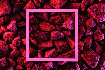 Trending space minimal neon red background with stones and white frame copy space. Asteroid or...
