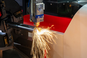 The fiber laser cutting machine cutting the stainless steel tube control by CNC program. The sheet...