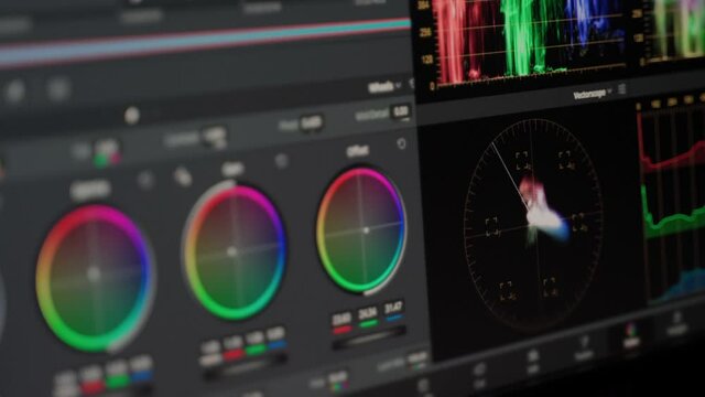 Post production video color correction process in professional software. Monitor view program used for changing color image on pro level. Wheels and scaopes can be seen