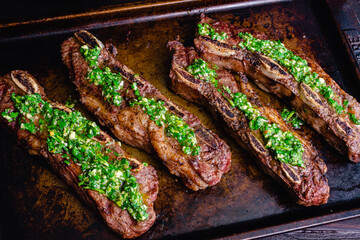 Argentinean-Style Grilled Short Ribs With Chimichurri: Barbecued flanken beef ribs topped with chimichurri sauce