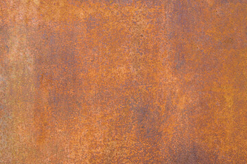 Background of a rusty metal wall. Rusted iron texture.