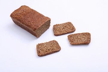 Sliced whole grain rye bread on white background