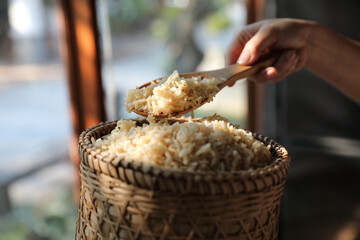 Organic boiled brown rice on Wicker basket in close up