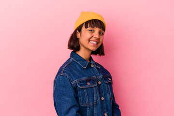 Young mixed race woman isolated on pink background confident keeping hands on hips.