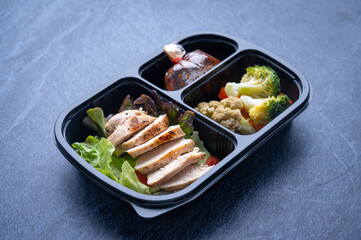 healthy food delivery for take away boxes for daily nutrition on blue background, ready to eat...