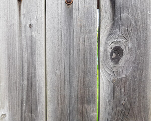 wooden fence with a gap in the yard