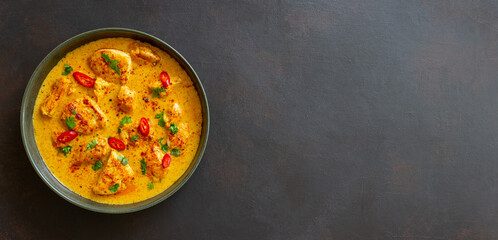 Chicken tikka masala curry with herbs and peppers. Indian food. National cuisine.