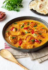 Chicken tikka masala curry with herbs and peppers. Indian food. National cuisine.