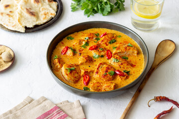 Chicken tikka masala curry with herbs and peppers. Indian food. National cuisine.