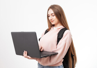 Young attractive caucasian woman student with backpack and laptop isolated on white background
