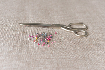 a series of cutting and sewing, a woman herself cuts a detail from a cloth with scissors, a tailor's ruler, pins at home on self-isolation.