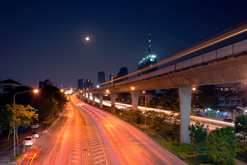 Fototapeta na wymiar Bangkok Thailand night traffic and street view in long exposure presenting for civilization, urban, night traffic concept.
