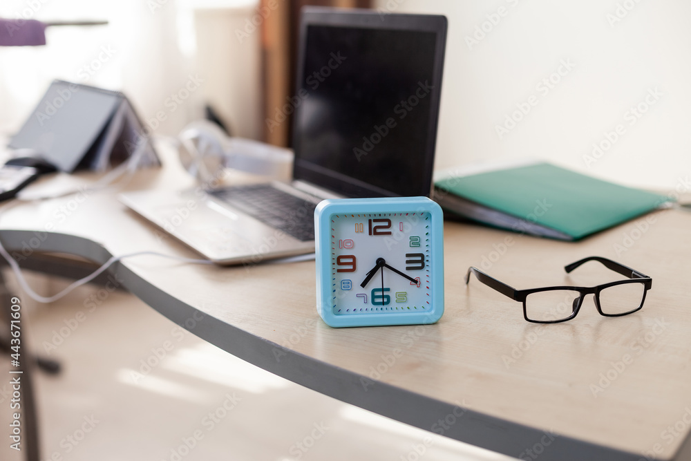 Poster alarm clock close up on table with workspace