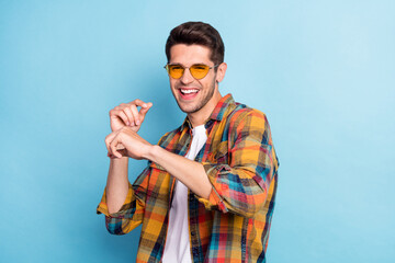 Portrait of attractive cheerful guy dancing having fun chill out free time isolated over bright...