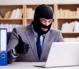 Criminal businessman with balaclava in office