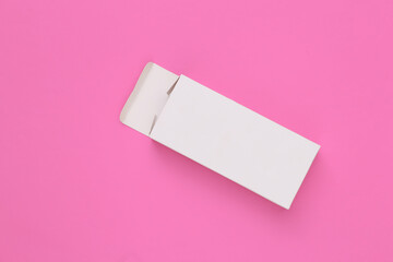 Open White packing box on pink background. Minimalism. Top view