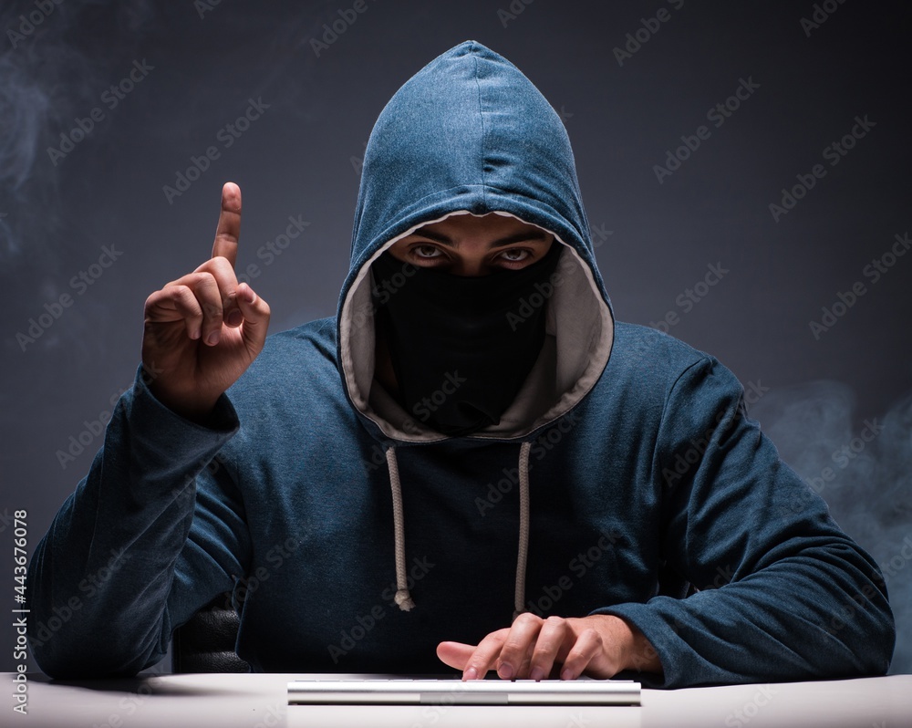 Aufkleber computer hacker working in dark room