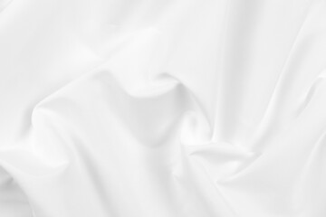 Fototapeta premium Abstract white fabric texture background. Cloth soft wave. Creases of satin, silk, and cotton.