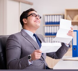 Businessman receiving letter in the office