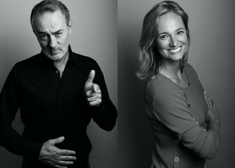 Two beautiful people in front of a background